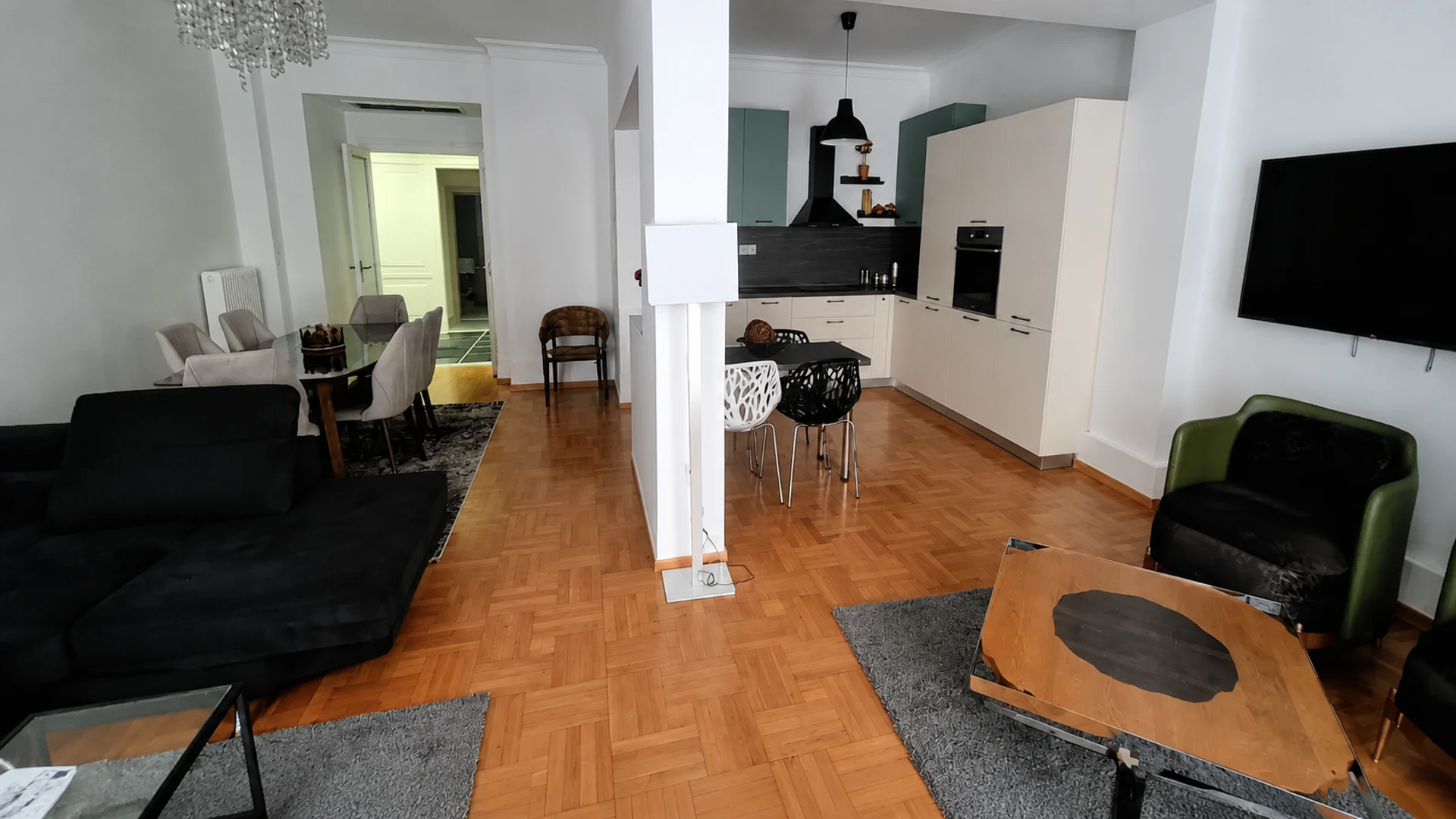 The spacious living room and kitchen at Petite Palace 2